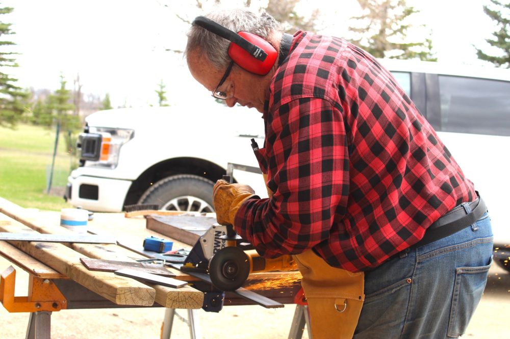 CHRIS GAREAU THE CARILLON
Michel Rozière hard at work building the base for a new cross to be displayed in Lorette.