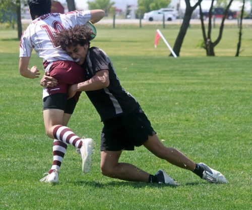 A Morris player tackles a St Paul's player during the semi-finals of the boys division. This is the first year the SRSS sevens tournament featured a boys division. (Cassidy Dankochik The Carillon)
