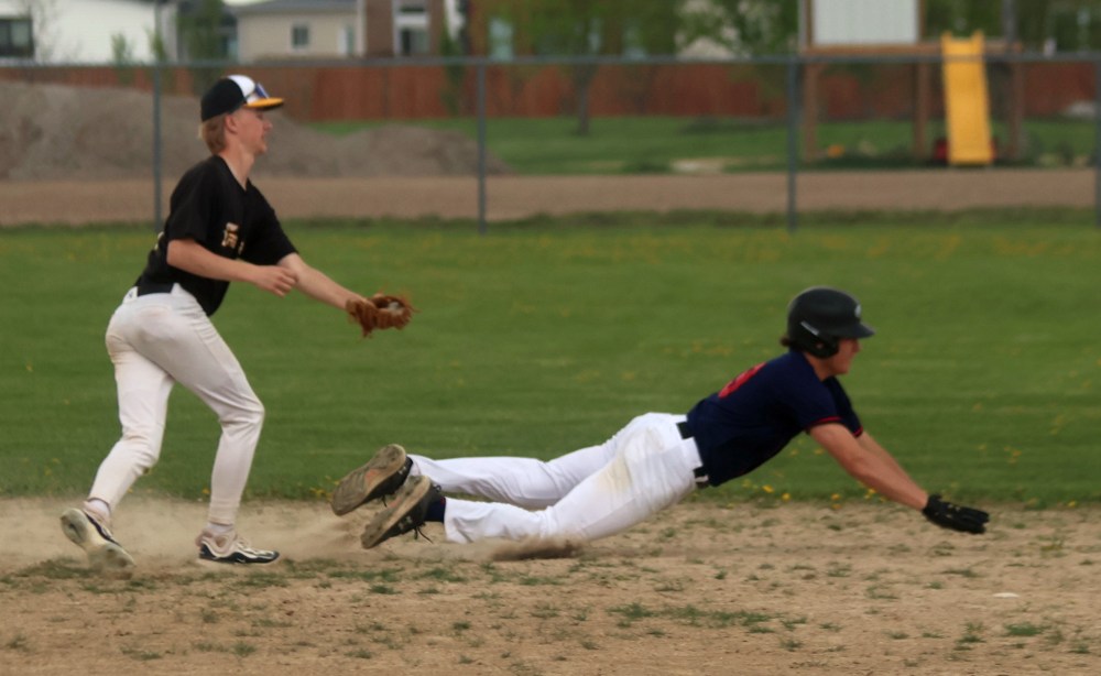 Zone 13 League baseball action in Mitchell. (Cassidy Dankochik The Carillon)
