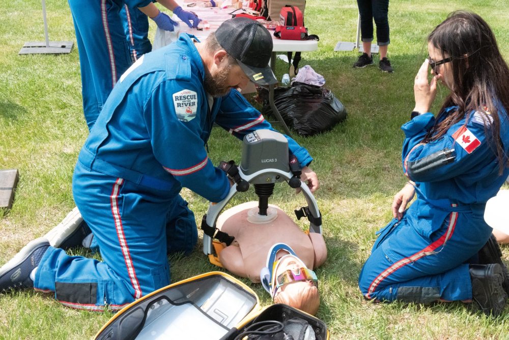 SVJETLANA MLINAREVIC THE CARILLON
Dan Aberhart, president of Aberhart Ag Solutions, puts a machine that does chest compressions on a dummy while flight paramedic Jennelle Paluk looks on during STARS Ambulance's Rescue on the River fundraising event at Kelburn Farms in Howden on May 29, 2025. The event saw three participants raise $50,000 each for STARS operations. In total, STARS raised $300,000 during the event and a fundraising gala later that evening.
