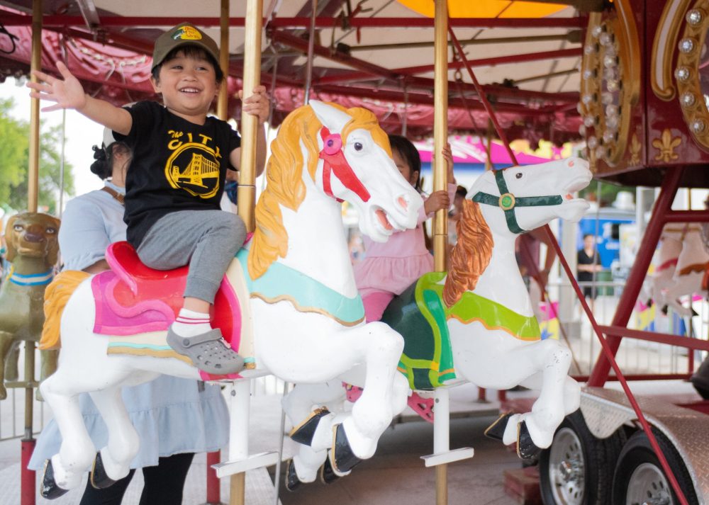SVJETLANA MLINAREVIC THE CARILLON
Matheo Victoria from Stienbach expressed his joy in riding the Merry-Go-Round at Summer in the City on June 13, 2025 in Steinbach.