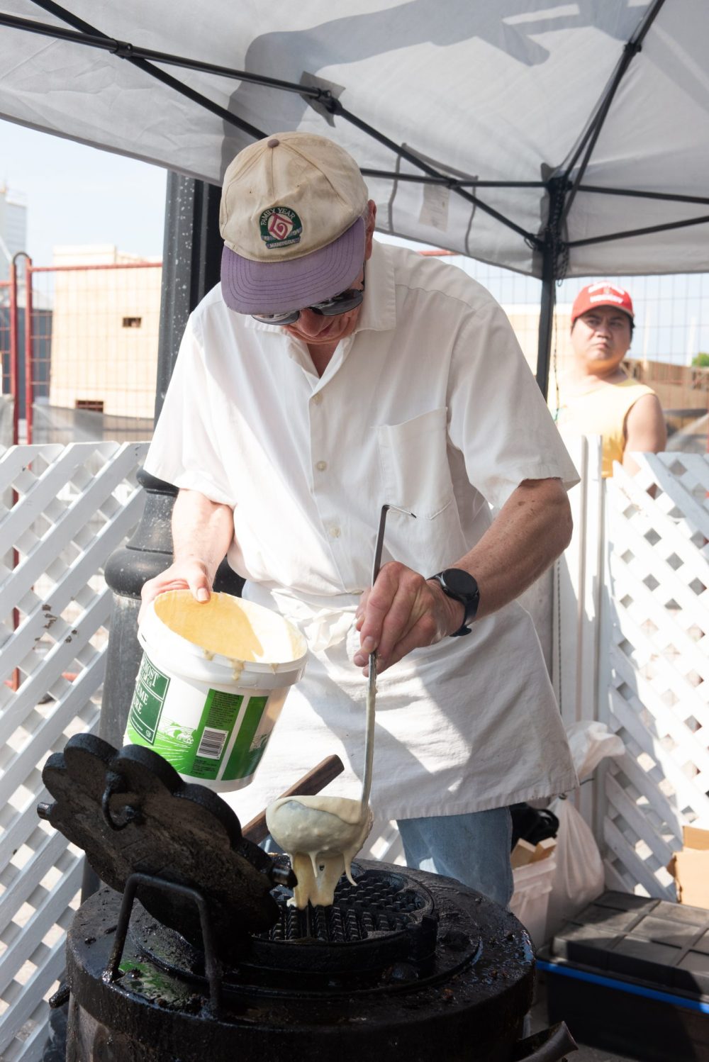SVJETLANA MLINAREVIC THE CARILLON
Dan Siemens puts batter on a wafffle iron at the Mennonite HEritage Village waffle stand at Summer in the City on June 13, 2025 in Steinbach. Every year the waffle satnd sells beteen 1,000 and 1,500 waffles.