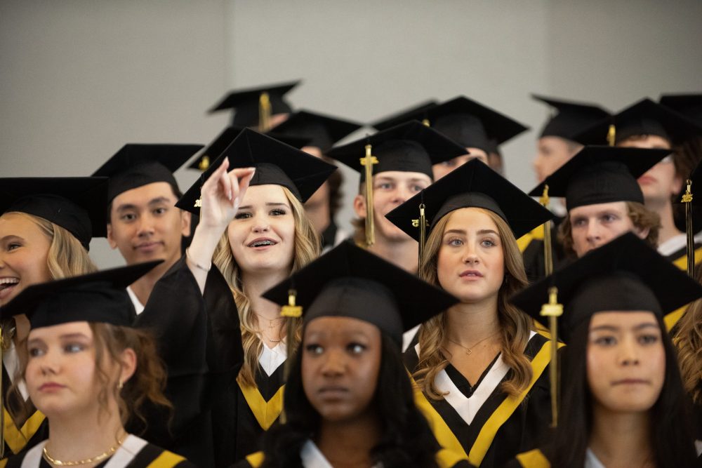 SVJETLANA MLINAREVIC THE CARILLON
A Steinbach Regional Secondary School graduate waves to her family before the graduation ceremony at the Winnipeg Convention Centre on June 24, 2025.