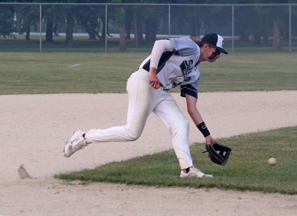 The Sultans' third baseman picks up a ball before gunning down a runner in 18U AAA baseball action June 5. Carillon head coach Burke Heide said the transition from 15U to 18U is toughest for fielders due to an increase in field size. (Cassidy Dankochik The Carillon)