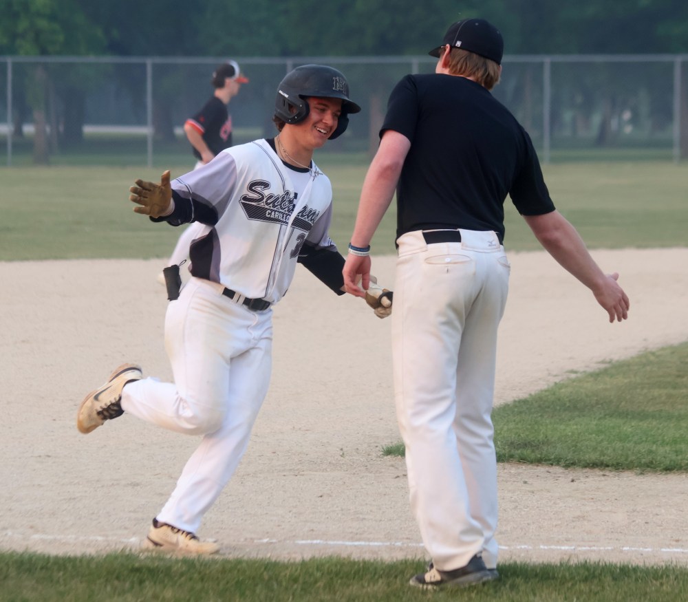 Nate Zilinski smiles as he rounds the bases following a home run. (Cassidy Dankochik The Carillon)