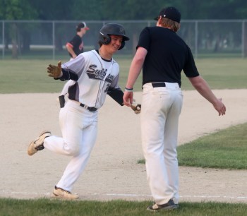 Nate Zilinski smiles as he rounds the bases following a home run. (Cassidy Dankochik The Carillon)