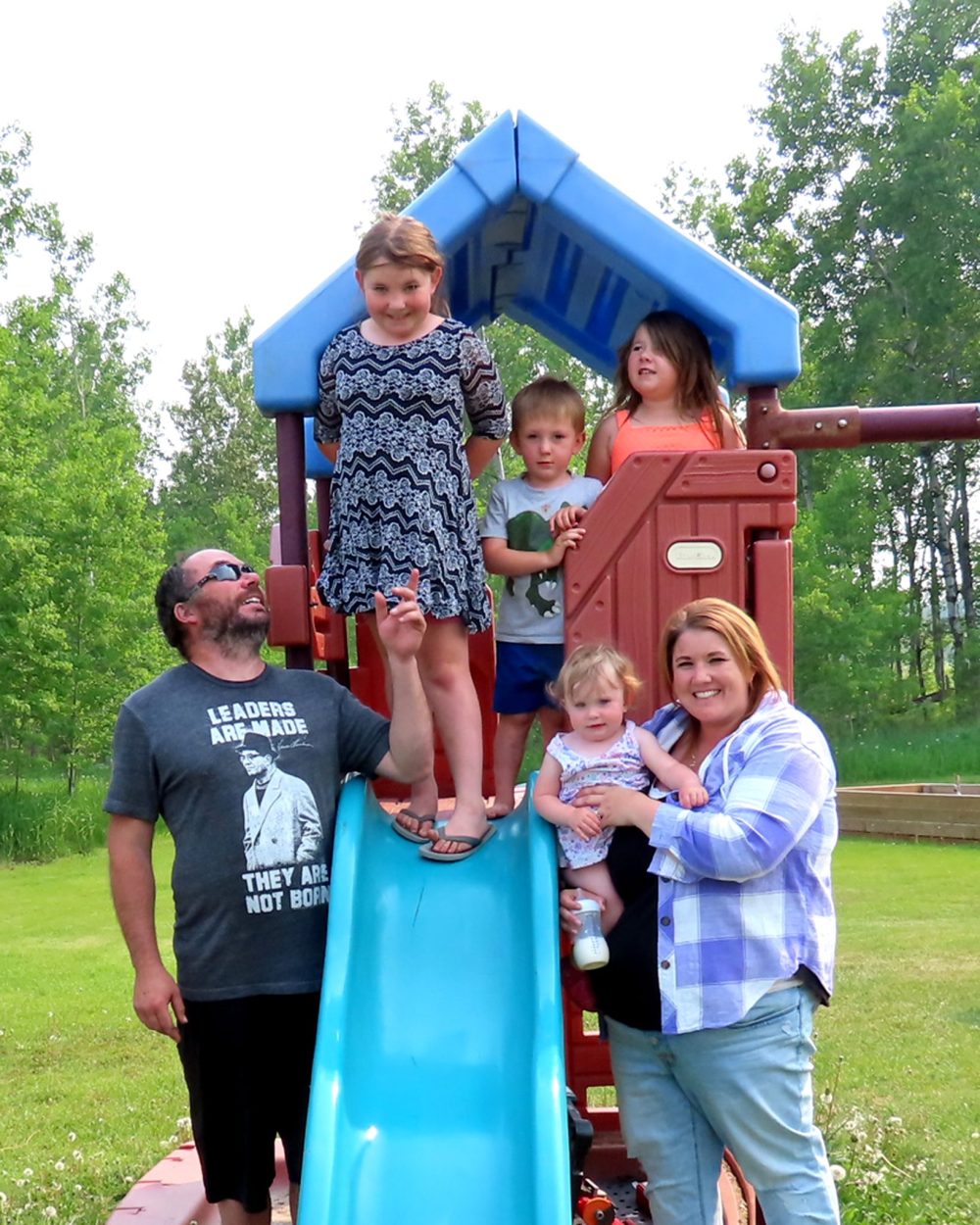 WES KEATING THE CARILLON
Trevor and Melissa Goulet with Regan, 7, Taylor, 5, Easton, 3, and Kinsley, 1, on the play structure which is the children’s favorite spot on the yard at Goulet Farms.