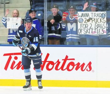 Connor Paronuzzi dazzles gathered kids during warm-ups of Steinbach's game against Selkirk March 14. It was the first game at the new Steinbach Event Centre. (Cassidy Dankochik The Carillon)