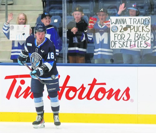 Connor Paronuzzi dazzles gathered kids during warm-ups of Steinbach's game against Selkirk March 14. It was the first game at the new Steinbach Event Centre. (Cassidy Dankochik The Carillon)