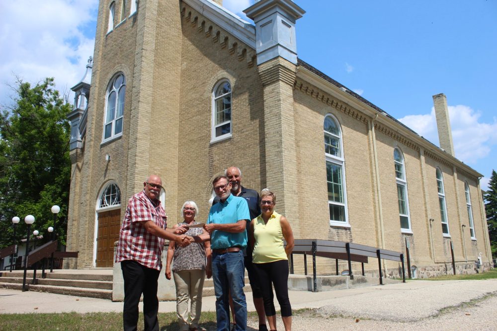 CHRIS GAREAU THE CARILLON
La Broquerie St Joachim Roman Catholic Church restoration committee president Lucien Grenier, secretary Lucille Bisson, Plett Foundation chair Royden Loewen, church board member Henri Turenne and treasurer Carmelle MacNeil.