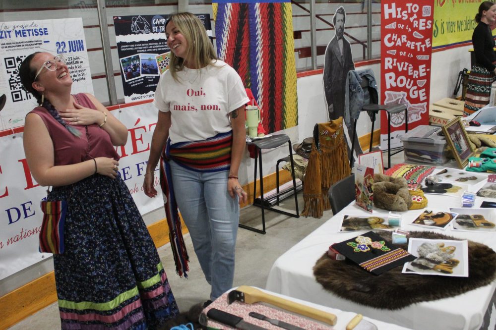 CHRIS GAREAU THE CARILLON
Laurie McDougall and Marie-France Mitchell share a laugh at Fête de la Saint-Jean-Baptiste in La Broquerie Sunday. McDougall is a hide tanner who shares her knowledge through the Union nationale métisse Saint-Joseph du Manitoba, which dates back to 1887.