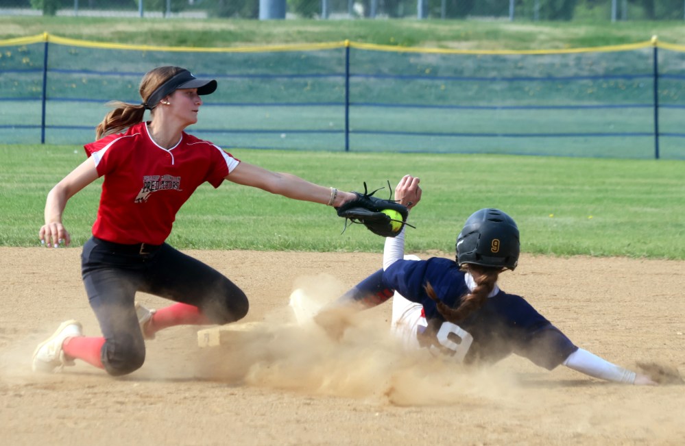 A Braves player just slides past an attempted tag at second base during a preliminary round game at provincials in Stonewall Quarry Park. (Cassidy Dankochik The Carillon)