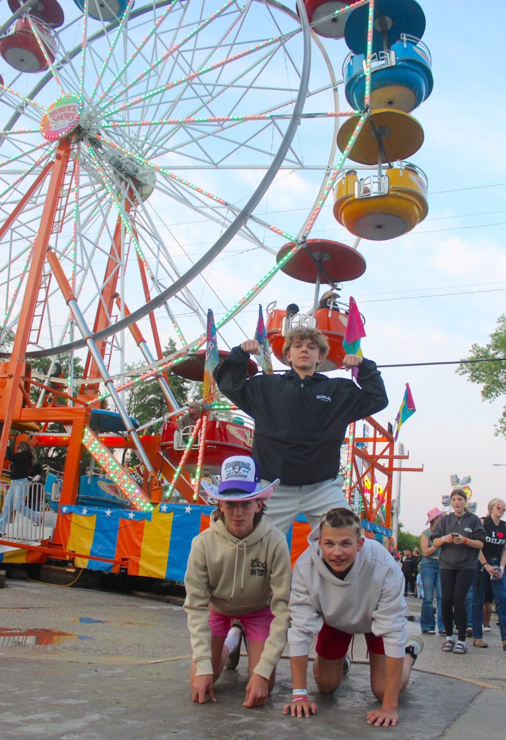 CHRIS GAREAU THE CARILLON
Asther Clarke gets some help from his friends Mason Coulombe and Brenden Oswald to check out the view on the midway.