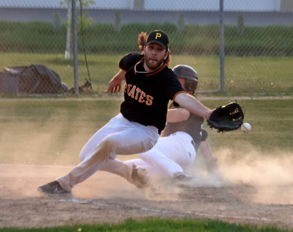 The North Winnipeg Pirates pitcher can't cover home base after a wild pitch during Carillon's victory May 27. (Cassidy Dankochik The Carillon)