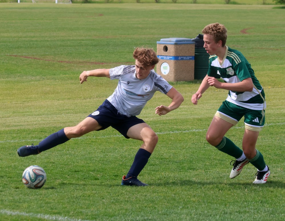 A Hanover player reels in a loose ball during their 1-0 win over Northwest FC in Steinbach June 7. (Cassidy Dankochik The Carillon)