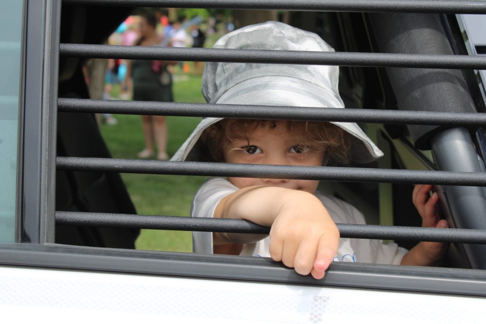 GREG VANDERMEULEN THE CARILLON
Dexter Friesen looks out through the bars from the back seat of the RCMP cruiser.