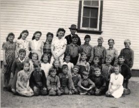 Rosengard students with their teacher, Mr. Jacob Penner ca. 1945.