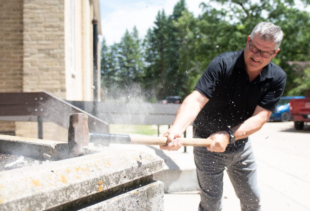 SVJETLANA MLINAREVIC THE CARILLON
Vice-president of Le Committee du 125 Ron St. Hilaire breaks the concrete for the flower pot infront of the Paroisse St Joachim on July 4, 2025. A cheque for $10,000 was given to the church for renovations to the stairs and ramp. The La Broquerie church has been fundraising for the past eight months and has amassed $500,000 in donations, grants, and in-kind gifts. The church has been a gathering place for La Broquerie residents for almost 125 years.