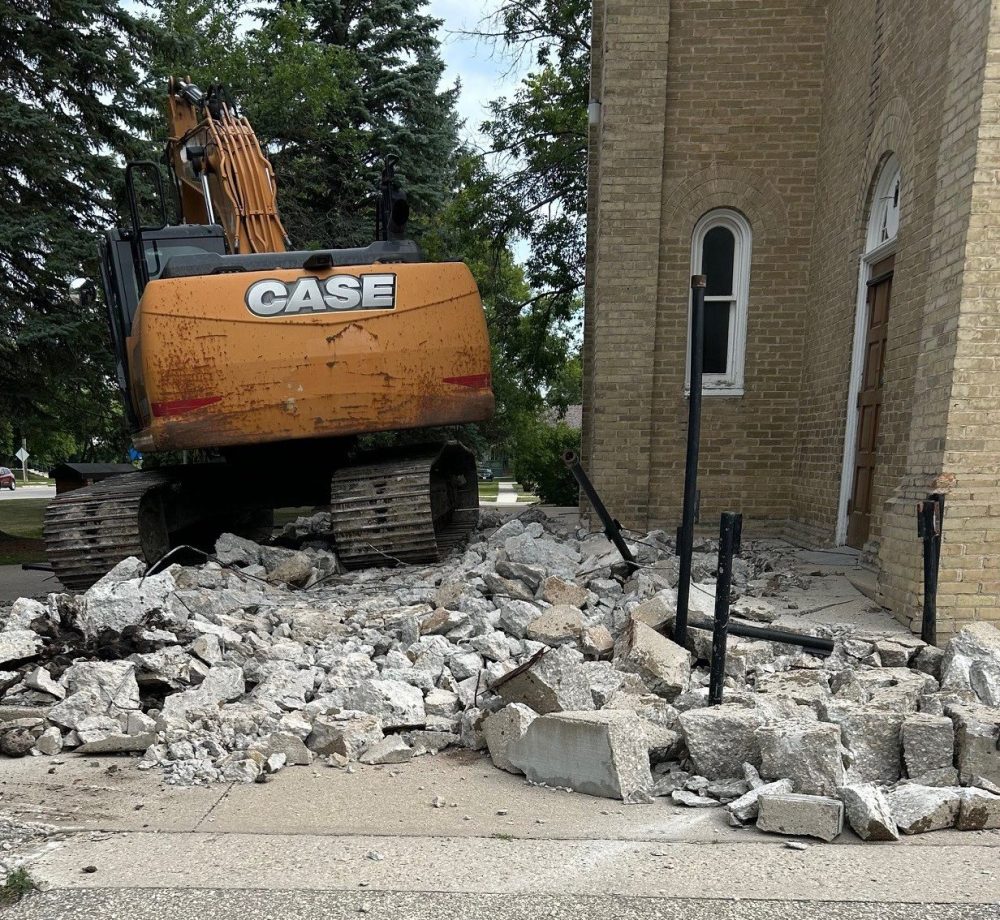 Submitted by Lucien Grenier
The demolition of the front stairs and ramp leading to St Joachim church in La Broquerie.