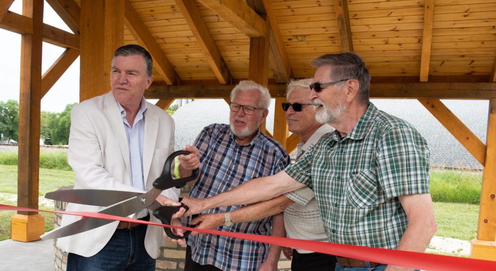 SVJETLANA MLINAREVIC THE CARILLON
Town of Niverville Mayor Myron Dyck, Cornie Funk, Bernie Falk, and Ernie Braun cut the ribbon during the opening of Station Lands Heritage Park. The park and its well and train tracks is a symbol of the history of Niverville with water, the train, and settlers to the area which all contributed to the creation of the town.