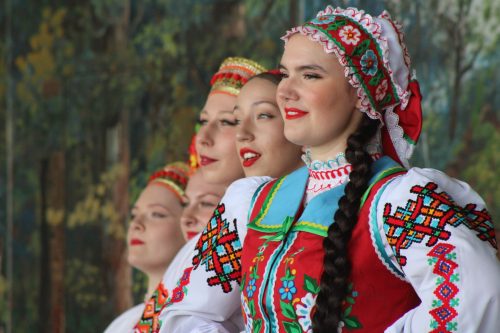 GREG VANDERMEULEN THE CARILLON 

Members of the Druzhba Ukrainian Dance Ensemble stand at attention as Bohdan Hoi performs the Ukrainian National Anthem, kicking off the 60th anniversary of the Gardenton Ukrainian Festival. The ensemble was founded in Winnipeg in 2022 with druzhba translating to “friendship”.