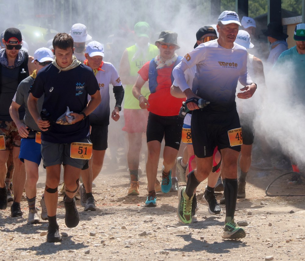 Runners enjoy a cooling mist as they start a lap at the Old Tom Backyard Ultramarathon. (Cassidy Dankochik The carillon)