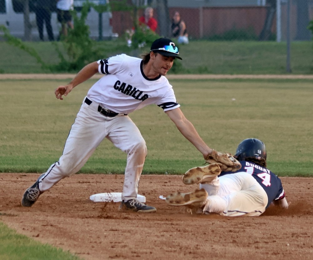 Cedric Lagasse tags out an Elmwood runner during game two of the MJBL finals at Koskie Field July 28. (Cassidy Dankochik The Carillon)