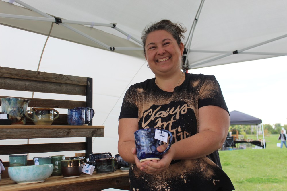 MATTHEW FRANK THE CARILLON
Erin Claeys holds one of her handmade clay mugs at the Centre of Canada Park on Aug. 22, 2025.