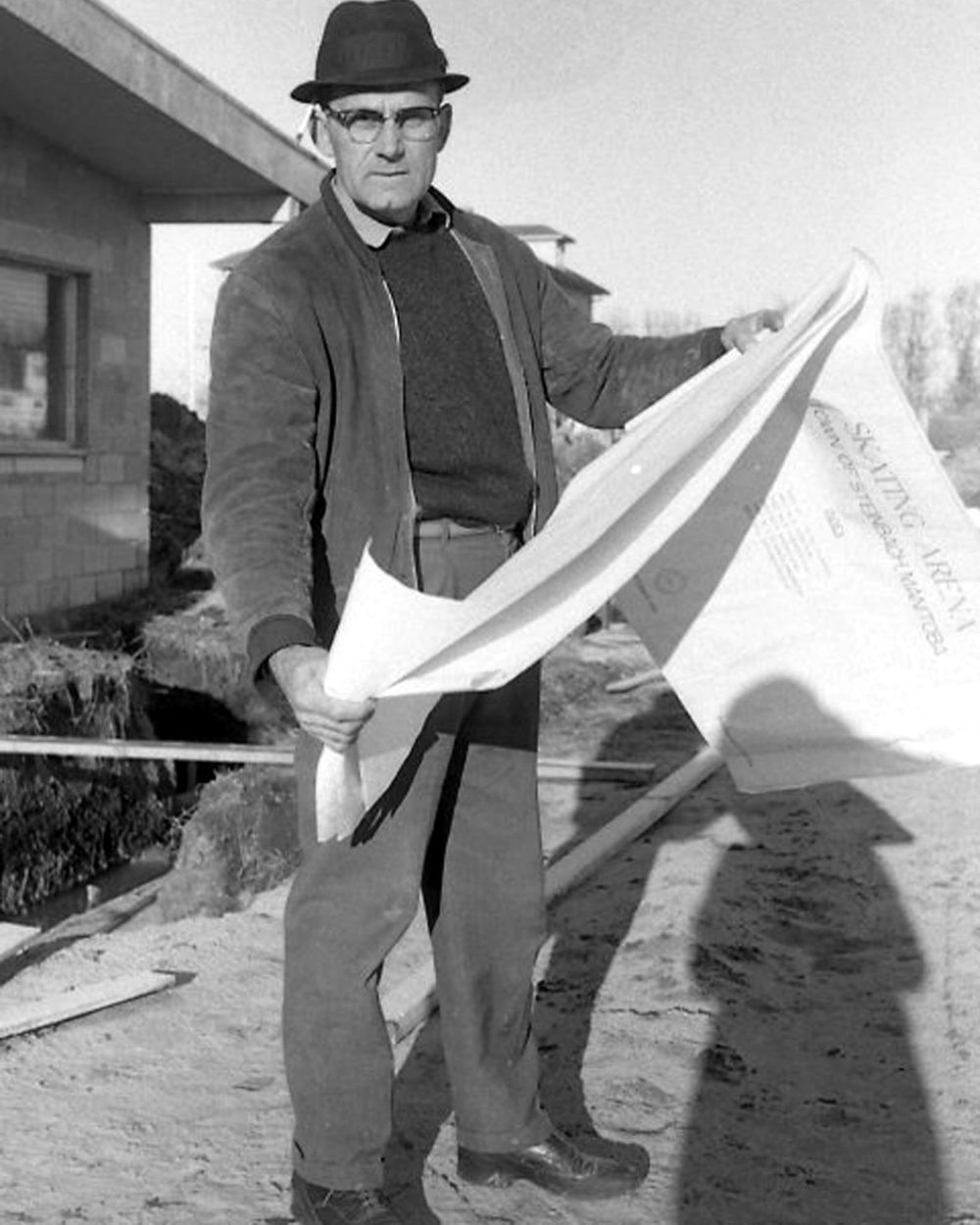 THE CARILLON ARCHIVES
A.K. Penner and Sons project supervisor R.B. Krentz looks over plans at the site of the Centennial Arena in October of 1966.