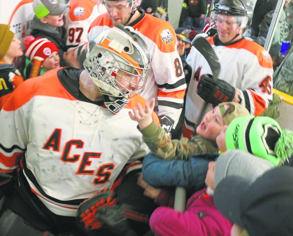 Guy St Vincent is mobbed by fans as he exits the ice after backstopping the Ste Anne Aces to a game two victory over the Portage Islanders in the 2022 SEMHL semi-finals. (Cassidy Dankochik The Carillon)