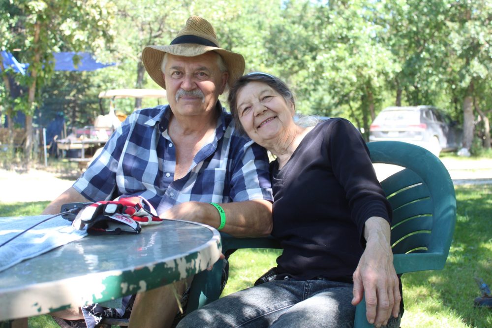 MATTHEW FRANK THE CARILLON
(From left) Georges Beaudry and his wife, Florence Beaudry, take a break from running errands for the festival. The couple has hosted the Rainbow Trout Music Festival on their property since 2012.