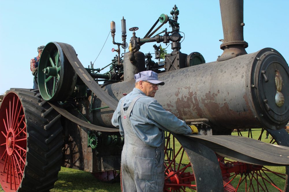 MATTHEW FRANK THE CARILLON
Bob Giesbrecht helps line up a belt on a 113-year-old steam engine.