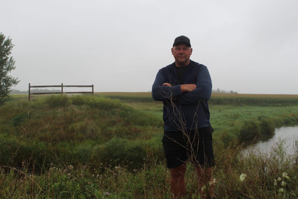 MATTHEW FRANK THE CARILLON
Farmer Arthur Rempel stands by Manning Canal that divides his corn fields and where the bridge previously was built on Sept. 2. Before it burned, the bridge made accessing his fields more convenient, Rempel said.