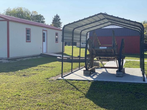 Submitted 

The Indigenous building to the right with the Red River ox cart in front at the Sprague and District Historical Museum. Opening ceremony for the building will take place on Sept. 20 at 11 a.m.
