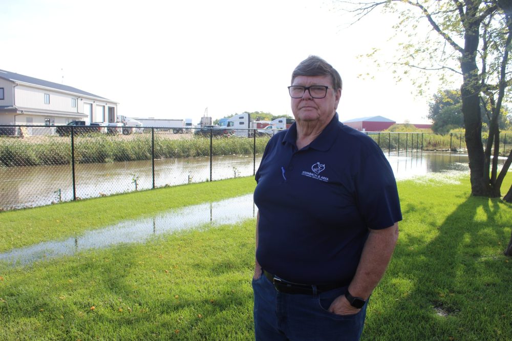 MATTHEW FRANK THE CARILLON Graham Pollock, vice president for Steinbach and Area Animal Rescue, stands by the overflowing ditch that flooded the shelter.