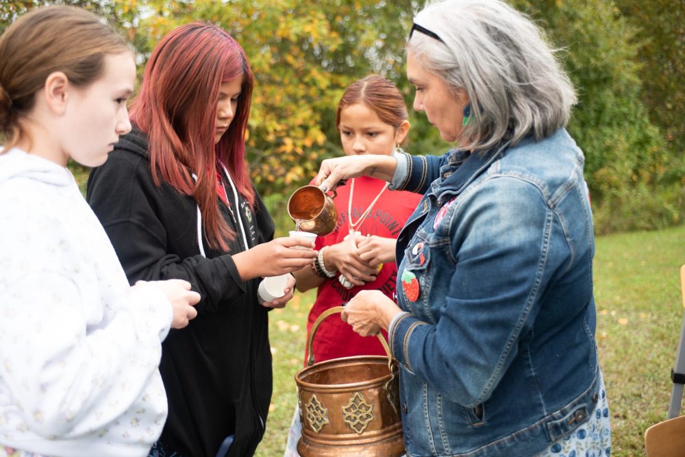 SVJETLANA MLINAREVIC THE CARILLON
Sprague and District Historical Museum opened the doors to its newest exhibit the Indigenous Building on Sept. 20, 2025. After the water ceremony, a pail of water was blessed which was held by Bentleigh Keffer, Adrianna Richard, and Angel Richard. Here Marie Murdock pours water into cups.