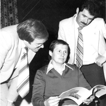 Ken Dryden and Manitoba Fitness Minister Bob Banman take a look at a history book the Oshawa Generals presented to Bill Heindl at a luncheon sponsored by the province for organizers and players participating in the 1980 Bill Heindl Benefit Game. Ken Dryden died Friday, September 5, 2025. He was 78.