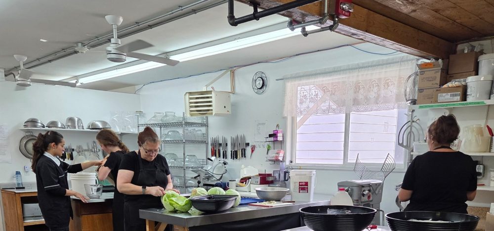 Livery Barn Restaurant kitchen staff preparing traditional Russian Mennonite foods for museum guests.
