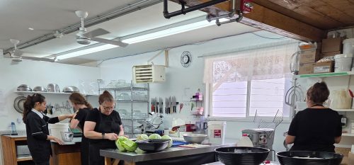 Livery Barn Restaurant kitchen staff preparing traditional Russian Mennonite foods for museum guests.