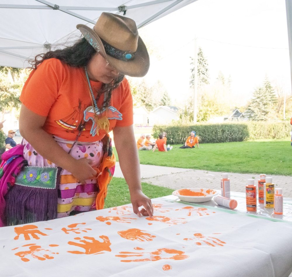 SVJETLANA MLINAREVIC THE CARILLON
Mino Odewin held its Orange Shirt Day Walk on Sept. 30, 2025. It's walk ended at the Steinbach Arts Centre where drummer and singer Rayne Ryle paints a heart onto her handprint for an Every Child Matters banner. The banner will be used for every walk going forward.