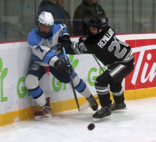 Eastman's Sophie Remillard pushes a Winnipeg Ice player off the puck during U18 AAA action at the Hockey for All Centre. (Cassidy Dankochik The Carillon)