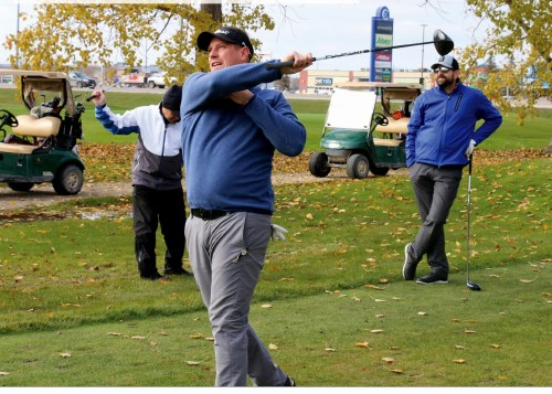 Nathan Mehling tees off on the 14th hole, swinging the club using only one arm, during the 2019 edition of the George Pauls Classic. For more than three decades golfers have been playing one hole during the annual tournament, using only one arm in recognition of Pauls, who passed away in 2014.