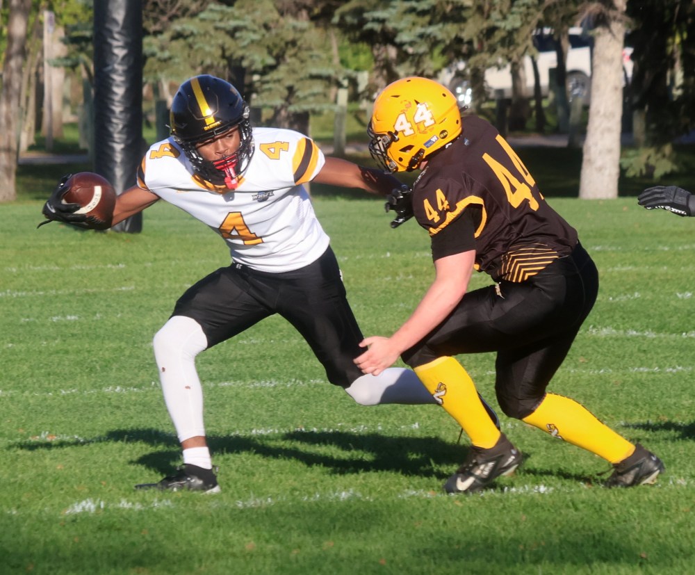 Seth Friesen looks to tackle a Dakota player during Steinbach Regional's 49-0 loss Sept. 26 at A.D. Penner Park. (Cassidy Dankochik The Carillon)