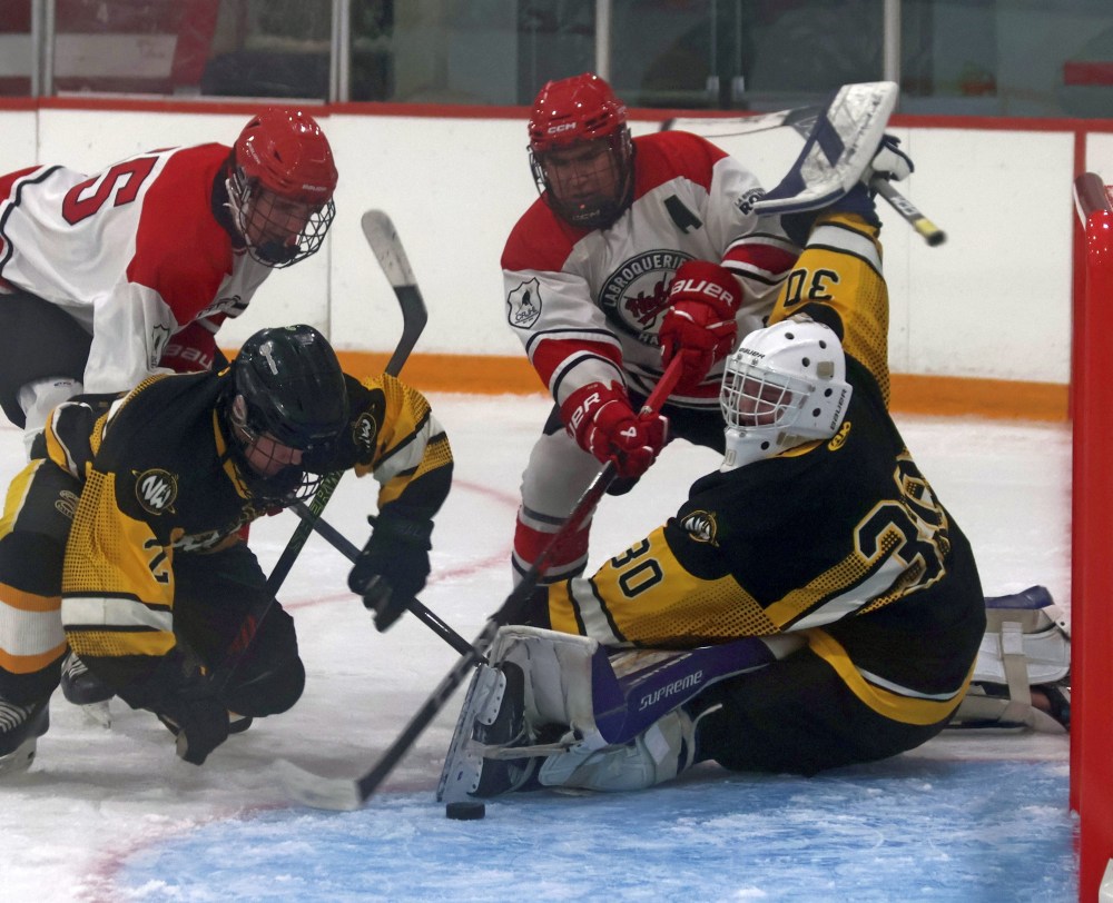 North Winnipeg goaltender Karson Hugenholtz battles for positioning in his own crease. (Cassidy Dankochik The Carillon)