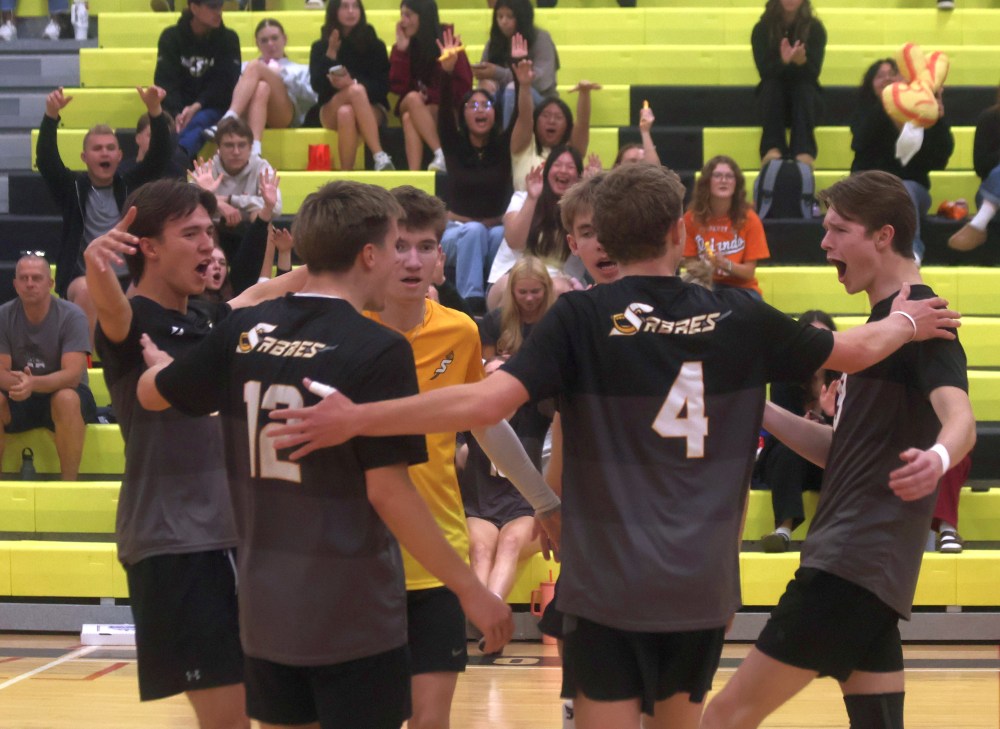 Steinbach Regional players and fans celebrate a block during the third set of their match against J.H. Bruns Sept. 29. (Cassidy Dankochik The Carillon)