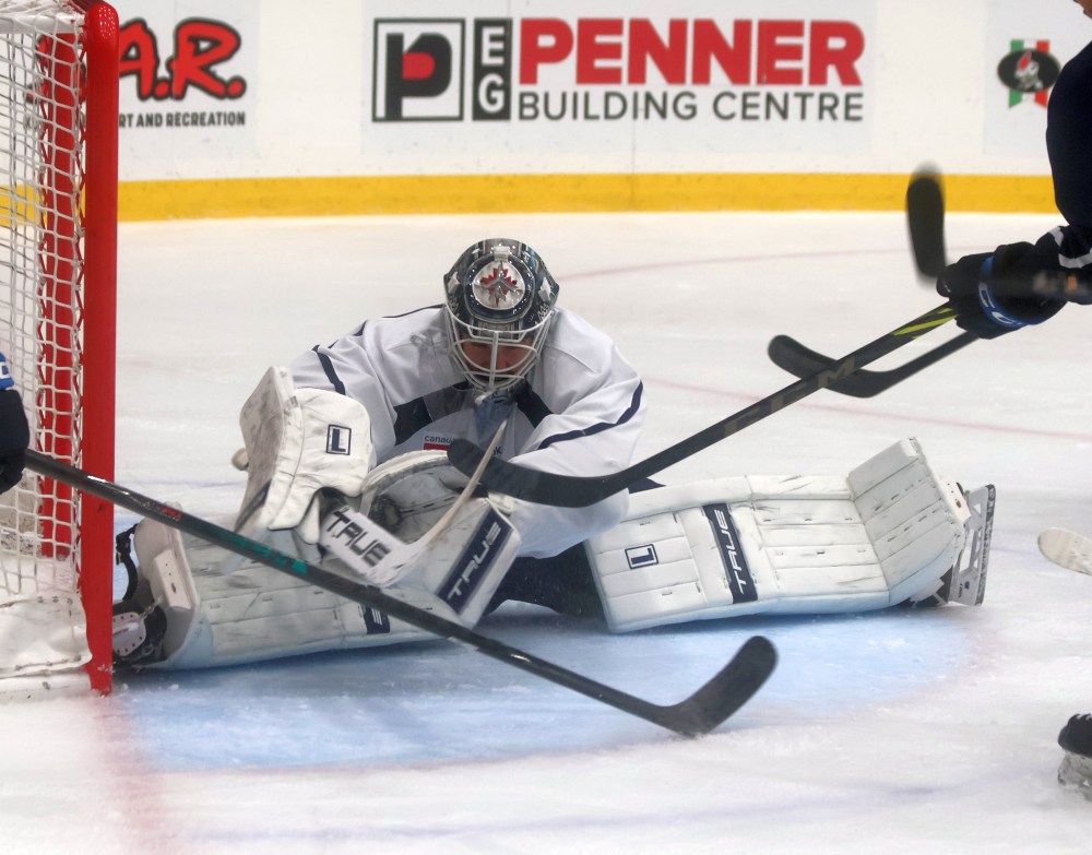 Manitoba Moose goalie Isaac Poulter robs a Jace Isley chance during first period action inside Steinbach's Southeast Event Centre. The centre played host to the Moose's annual intra-squad game Oct. 5. (Cassidy Dankochik The Carillon)