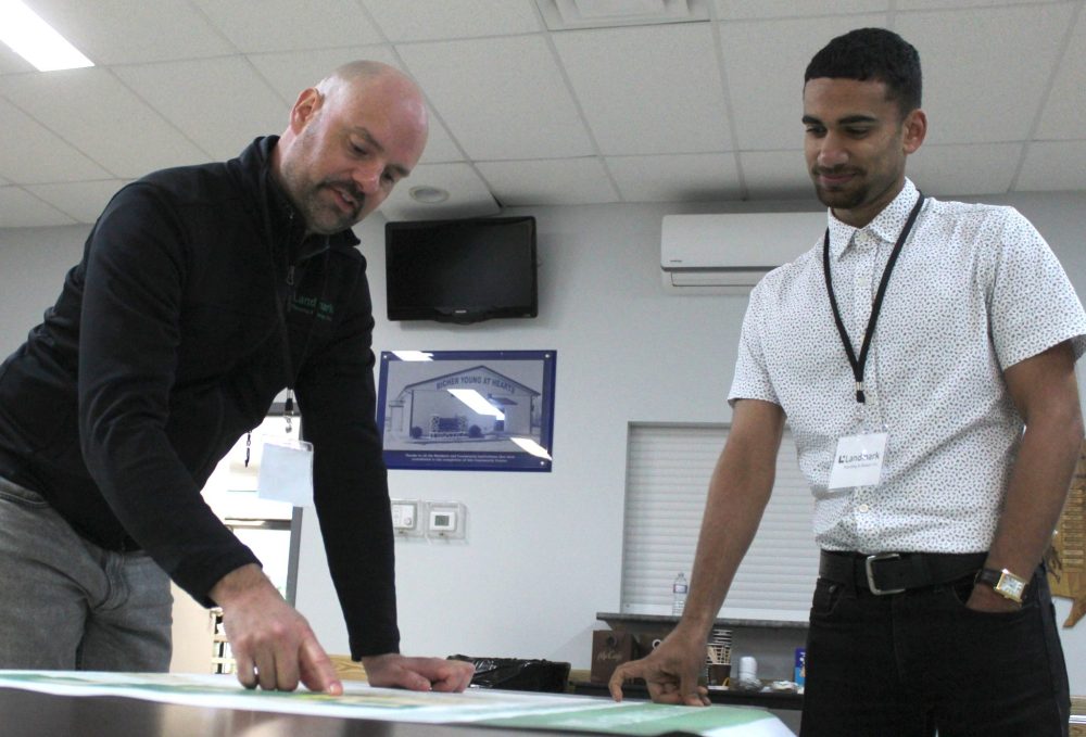 MATTHEW FRANK THE CARILLON
Left, Andrei Friesen, a senior planner for Landmark Planning & Design Inc and junior planner Matt Gowdar discuss land plans for the RM of Ste Anne during an open house event in Richer on Oct. 14, 2025.