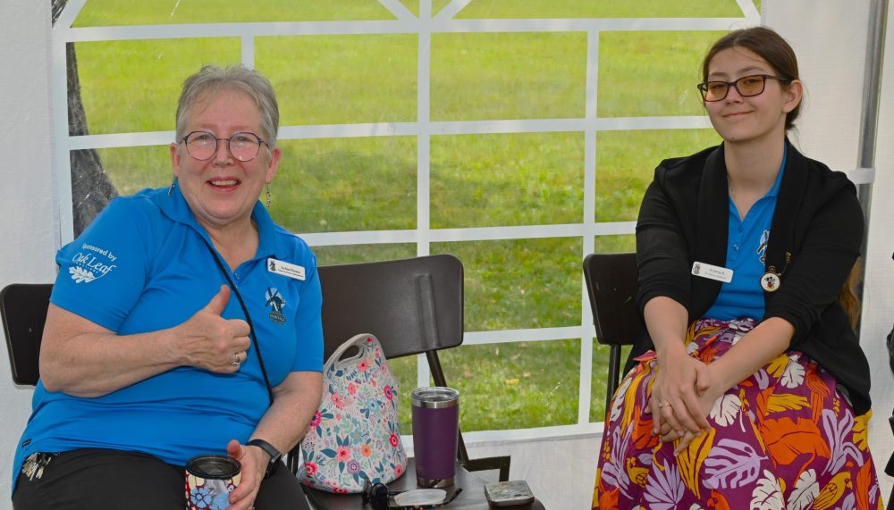 Jo-Ann and Brianna offering old fashioned candy during Pioneer Days.