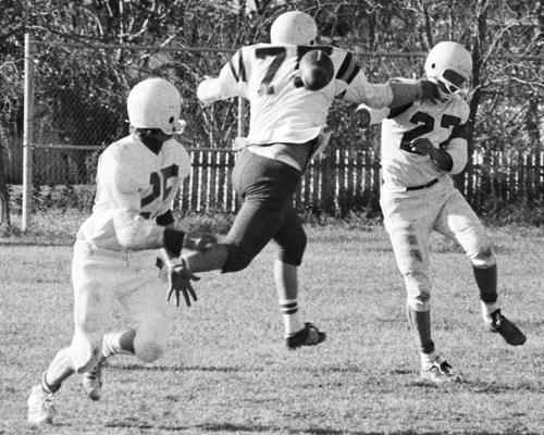Wilmer Penner gets a screen pass away, in spite of a fierce rush by Roger Chartrand and Ken Sonnichsen gains 10 yards on third down to keep Landmark’s drive going in the dying minutes of the RMIFL semi-final game.