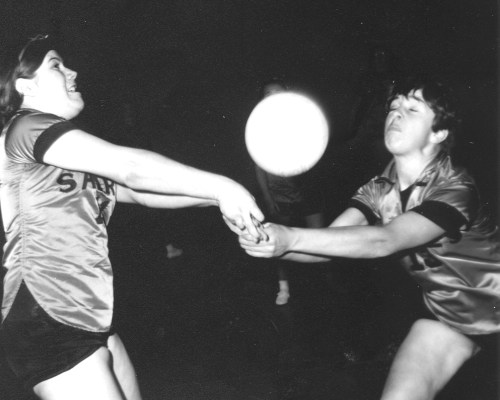 Nancy McMillan and Betty Poetker team up to bum back another serve, showing the kind of strong defensive teamwork that helped the SCI Sabrettes earn the first-ever provincial high school volleyball championship for a rural school.